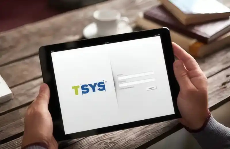 person holding a tablet with a login screen